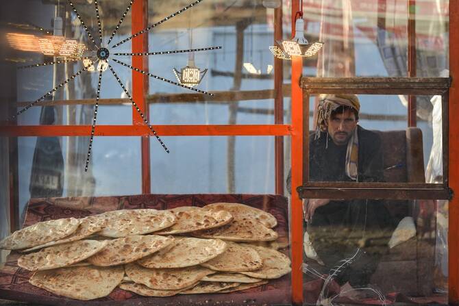 Afghanistan economic recovery buckles as nine in 10 families go hungry or into debt, UNDP says
